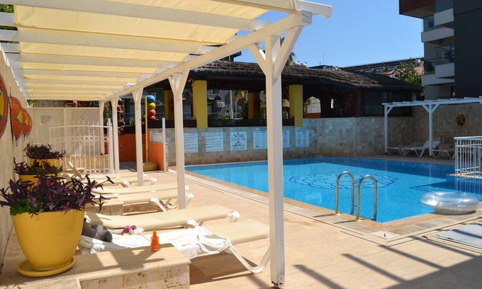 Side Apartment | Beachside Haven with Large Pool and Family-Friendly Amenities