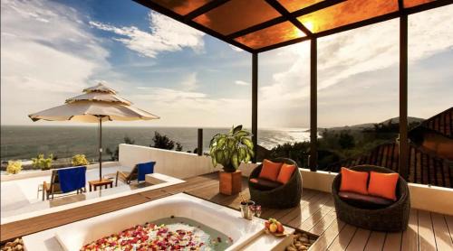 Phu Hai Beach Apartment | Relax at The Cliff Residence: Oceanfront Haven with Pool