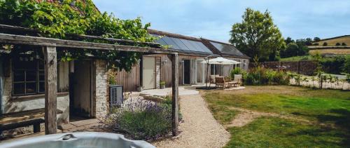 Dursley House | Relax at The Cow Byre: Cotswold Retreat with Hot Tub