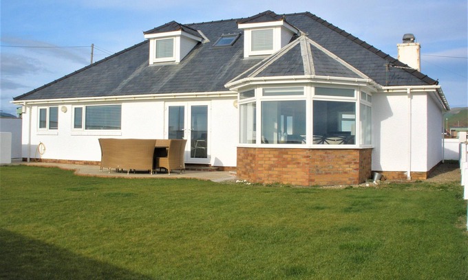 Tywyn House | The Gables is a large bungalow on the sea front with great sea views and sunsets