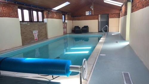Tunstead House | Discover The Granary: Pet-Friendly Retreat with Pool Access
