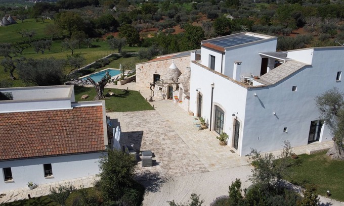 Castellana Grotte House | Experience The Hague of Cucumo: Poolside Paradise Awaits