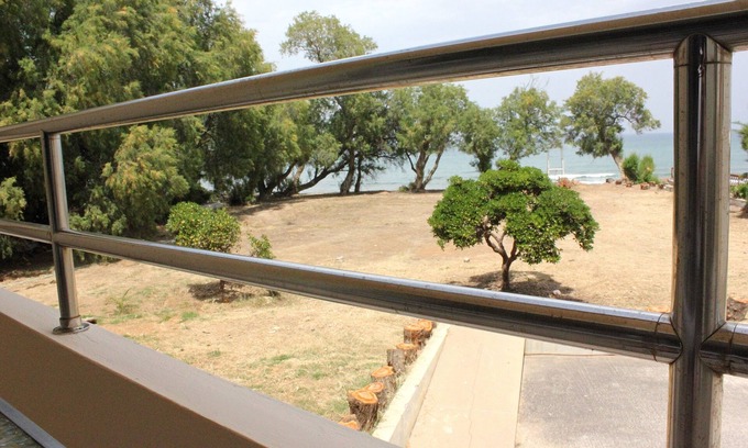 Kato Stalos Apartment | Beachside "LifeGuard" Flat with Pool & Ocean Views