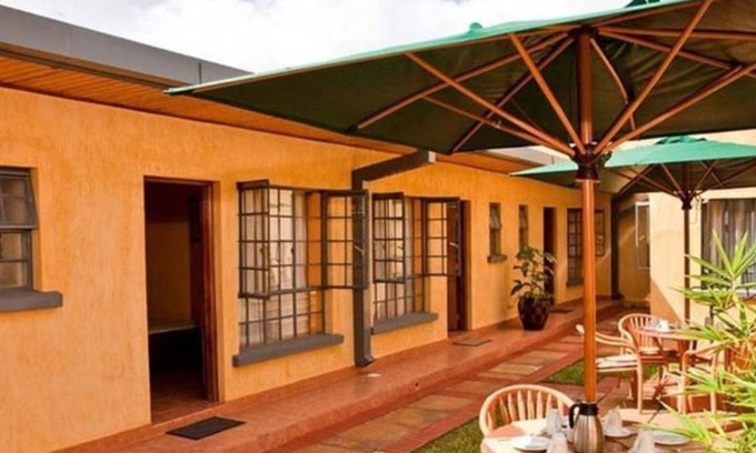 Nkubu Hotel | Discover The Meru House: Family-Friendly with Kitchen Amenities