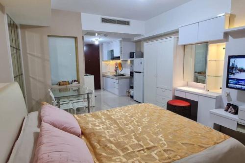 Tangerang Apartment | Modern U-Residence: City Views & Poolside Relaxation