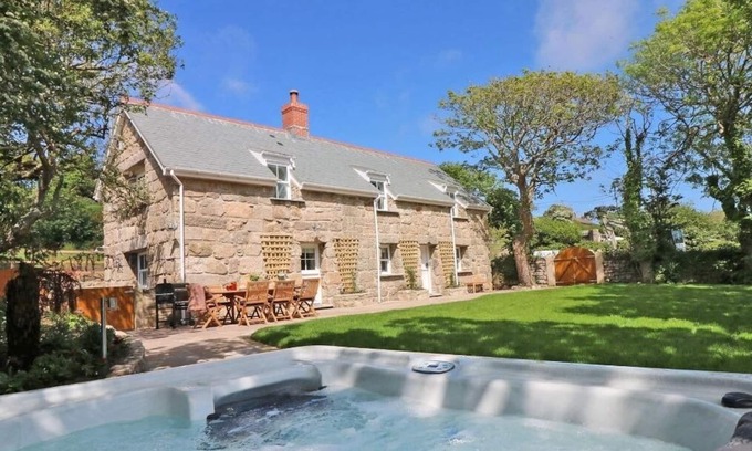 Penzance Cottage | Relax at The Old Forge: Pet-Friendly with Hot Tub Access