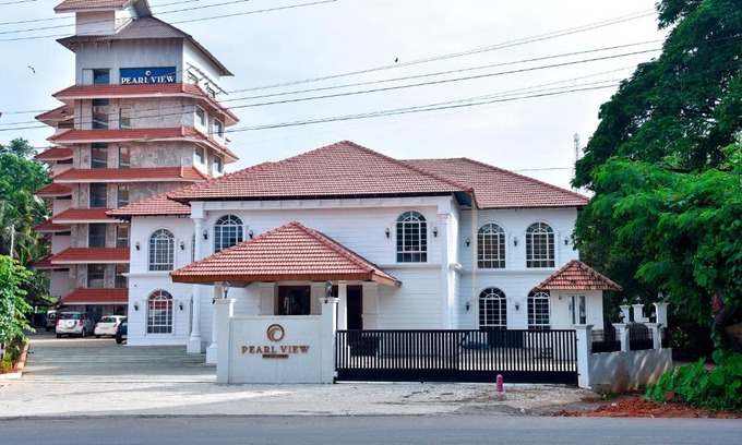 Kannur District Hotel | Discover The Pearl View Hotel: Poolside Relaxation Awaits