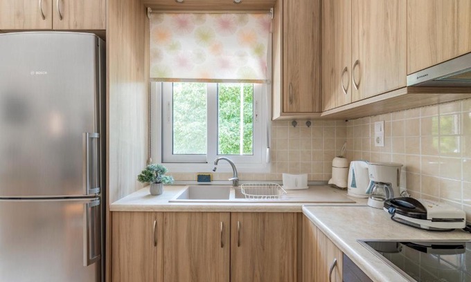 Gortyna Apartment | Top-Rated Family Retreat at Platano Village Residence