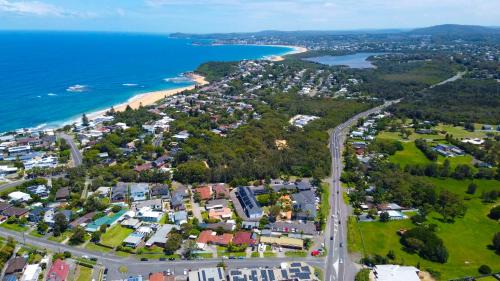 Forresters Beach Hotel | Relax at The Quarters: Oceanfront Retreat with Pool & Dining
