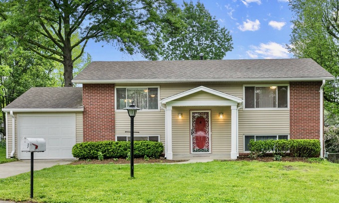 Maryland Heights House | Cozy Red Door Retreat: Exceptional Stay with Pool & Kitchen