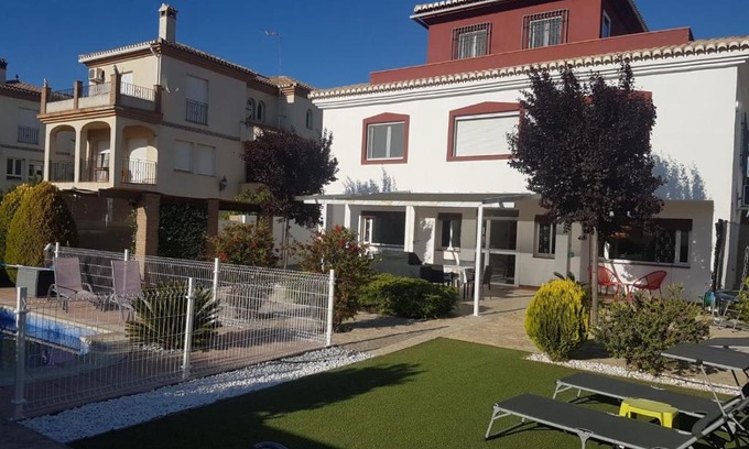 Alhendin Apartment | Discover The Red House: Oceanfront Haven with Pool Access