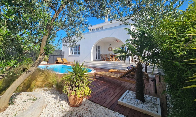 Arbanija Villa | Spacious Oceanview Apartment Surrounded by Lush Gardens