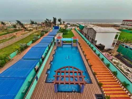Mandarmani Resort | Explore Triton Beach Resort: Family-Friendly with Pool & Dining