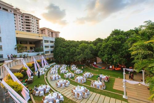 JP Nagar Hotel | Inviting Stay at The Woodrose with Pool & Breakfast Included