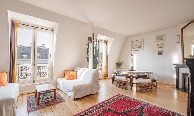 Grenelle Apartment | Experience Theatre in the Sky with Spa and Family Amenities