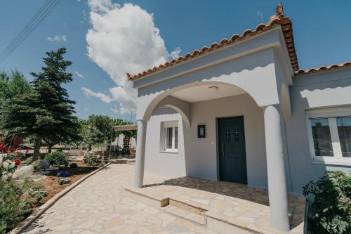 Velon House | Relaxing Village Kiato Home with Ocean Views for Families