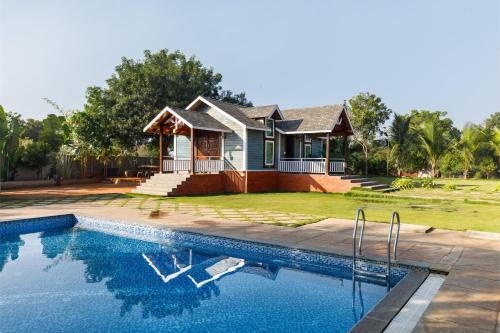 Bhongir Villa | TheSunlitHaven Pool GlassRooms Lawn