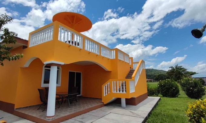 Colon House | This Hidden paradise located right on the Caribbean Ocean & big tall Mountains.