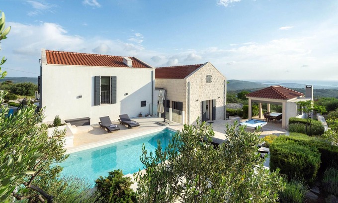 Rogoznica House | This modern and bright vacation home is located in a small village in the hinterland of Rogoznica.