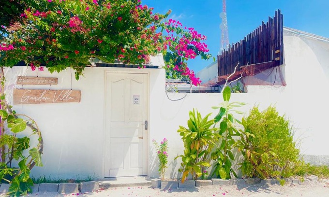 Thulusdhoo Island Villa | Relax at Thulusdhoo Garden Villa with Oceanfront Amenities