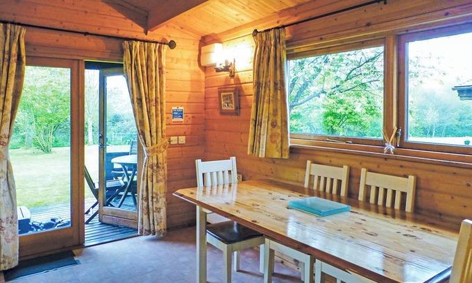 Cullompton Ski Chalet | Inviting Timber Lodge with Hot Tub and Family Amenities