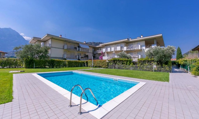 Torbole sul Garda Apartment | Relax in Torbole: Pool & Balcony Apartment Retreat