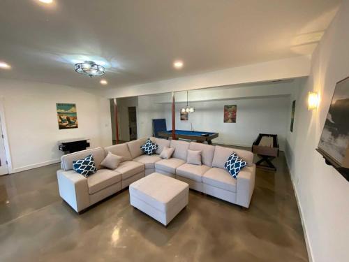 Kewadin House | Beachfront Retreat: Torch Lake Blue 4BDR House with Pool