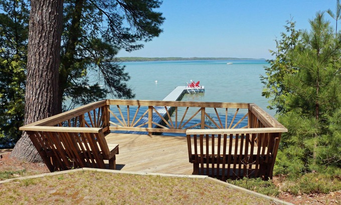 Rapid City House | Waterfront Torch Lake Sandbar Home with Dock & Views
