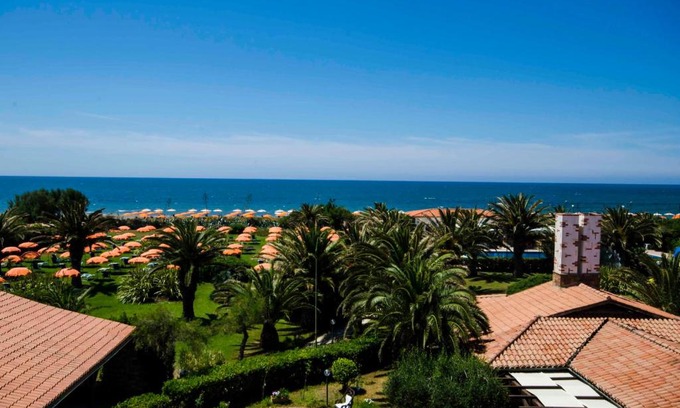 Tarquinia Hotel | Relax at Torre Del Sole with Ocean Views and Pool Access