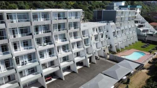 Amanzimtoti Apartment | Relax at Toti Cabana 58: Oceanfront Retreat with Pool