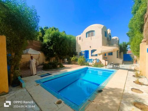 Al Fayoum Apartment | Discover Touha House: Oceanfront, Pet-Friendly Retreat