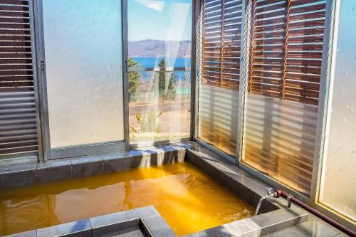 Sobetsu Apartment | Cozy TOYA ONSEN VILLA: Family-Friendly with Hot Tub Bliss