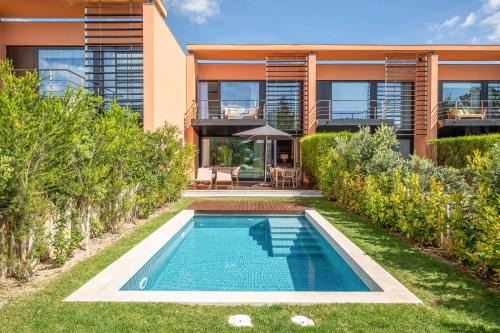 Carvalhal Villa | Tróia Villa Serenity: Oceanfront Escape with Pool Access