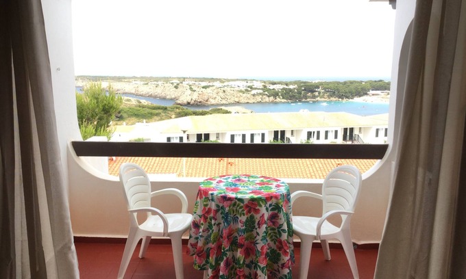 Arenal d'en Castell Apartment | Serene Apartment with Ocean Views, Steps from the Beach