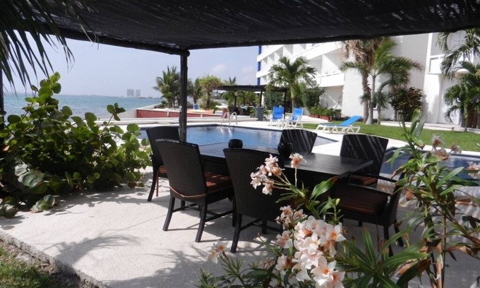 Puerto Juarez Apartment | Serene Oceanfront Getaway with Spa and Pool Amenities