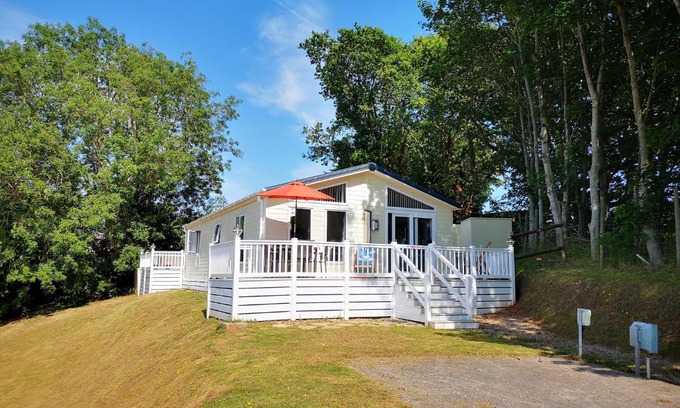 Dawlish Warren House | Discover Trevellian: Scenic Boutique Lodge with Ocean Views