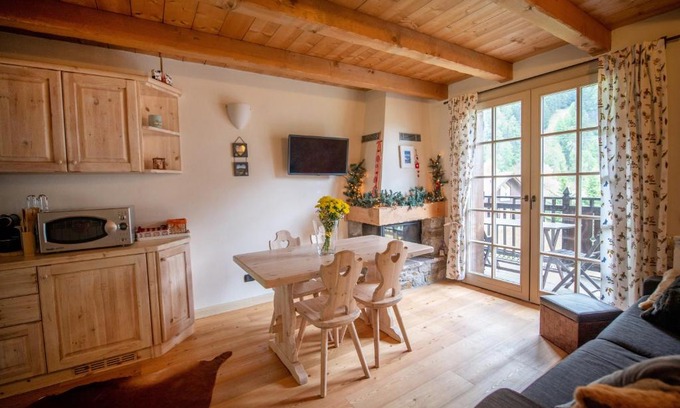 Ponte di Legno Apartment | Dine in Tranquility at TRILOCALE ALPES: Relax and Unwind