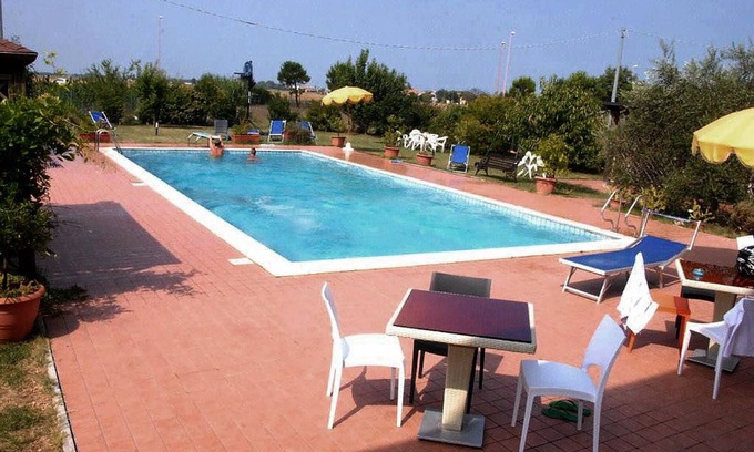 Quartiere Cervese Nord Apartment | Trilocale with Pool Access and Oceanfront Views