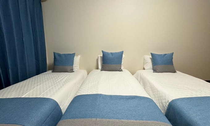 Namba Apartment | Inviting Triple Room in Osaka with Breakfast & Family Amenities