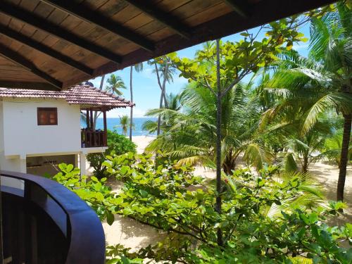 Tangalle House | Inviting Tropical Garden: Oceanfront Stay with Pool Access