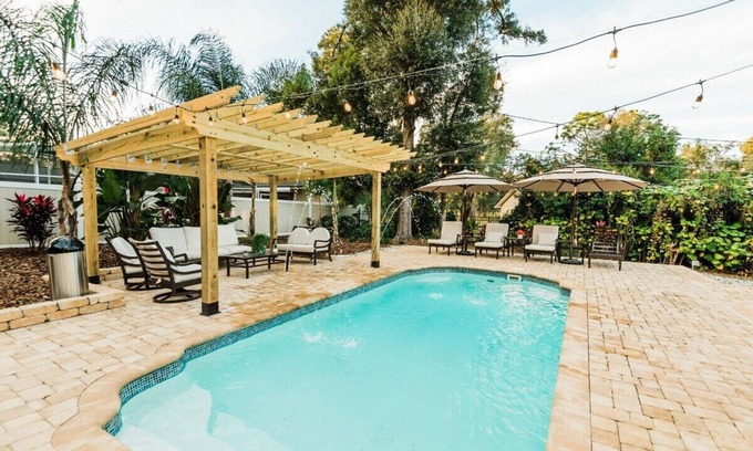 Longwood House | Indulgent Tropical Oasis with Heated Pool & Game Room