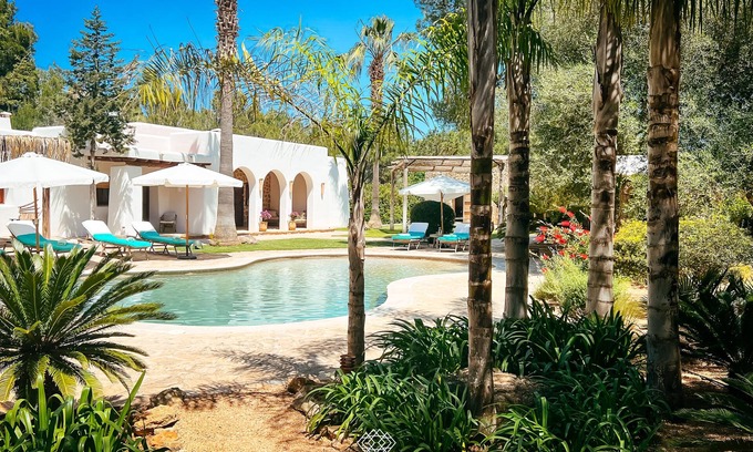 Santa Eulalia del Rio Villa | Idyllic Tropical Retreat for 16 with Pool and Cinema