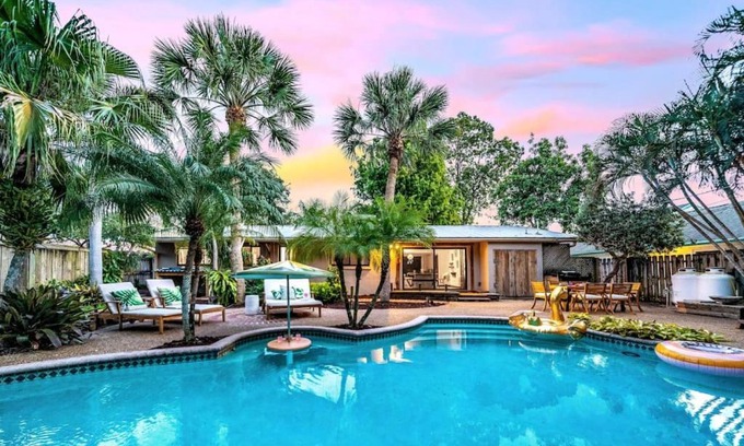 South Corals House | Relax in Tropical Pool Tiki Heaven with Family-Friendly Amenities