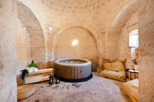 Cisternino Apartment | Enchanting Trullo in Ulivi with Pool & Hot Tub Amenities