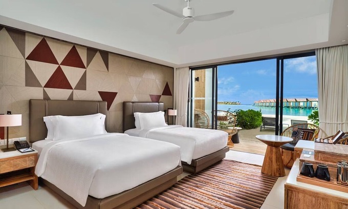 Farukolhufushi Island Hotel | Beachfront Retreat: Unwind at Hard Rock Maldives