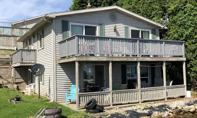 Manitou Beach-Devils Lake Cottage | Relax in Two Bedrooms with Sunrise Lakefront Views