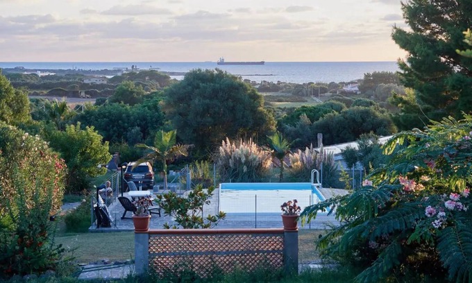 Calasetta Cottage | Seaside Retreat: Two-Room Apartment with Pool Access