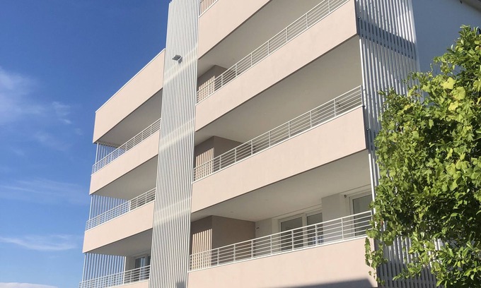 Lido di Jesolo Apartment | Experience Ulysses Palace: Family-Friendly with Pool Access