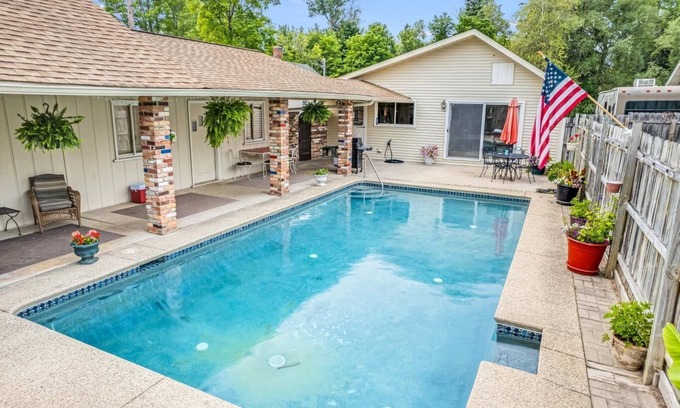 West Branch Cottage | Relax in Northern Michigan: Poolside Fun & Golf Awaits!