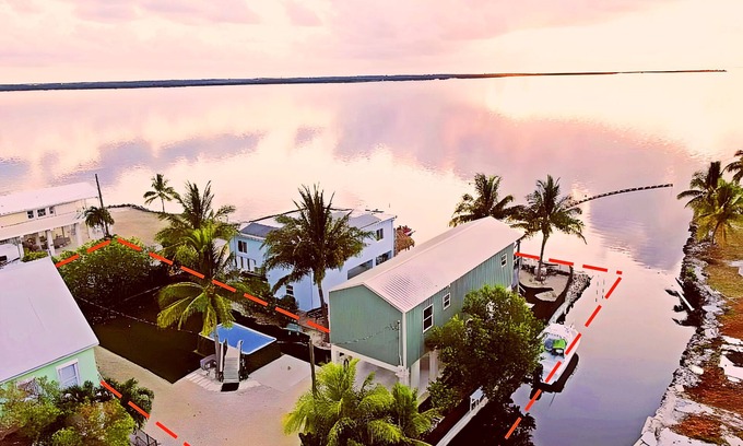 Sands House | Exceptional Oceanfront Home with Canal Access and Pool
